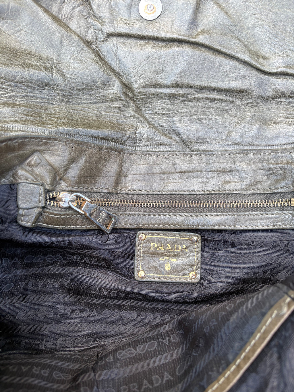 Vintage old leather khaki green Prada bag